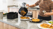 woman serving fried chicken with air fryer waffles